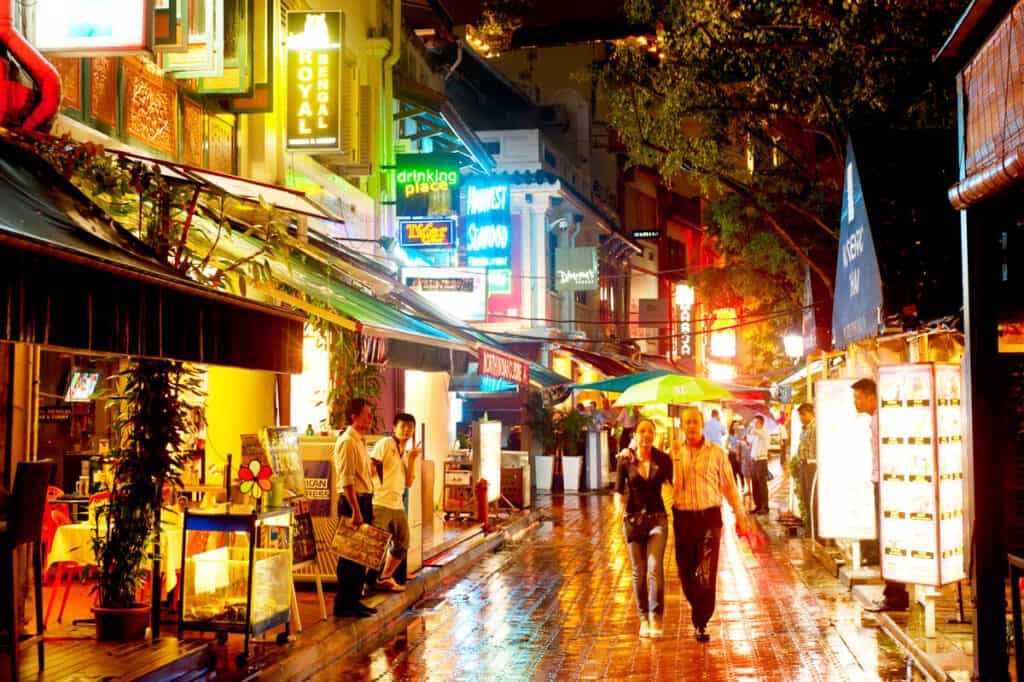 Raining in Boat Quay during twilight in Singapore. 