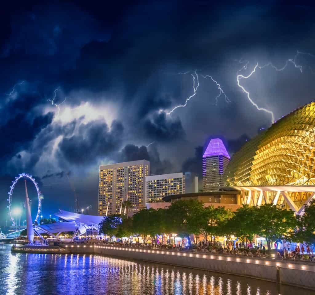 Singapore skyline in Marina Bay during a night thunderstorm.