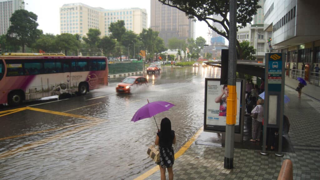 Heavy rain and a flooded street in Singapore.