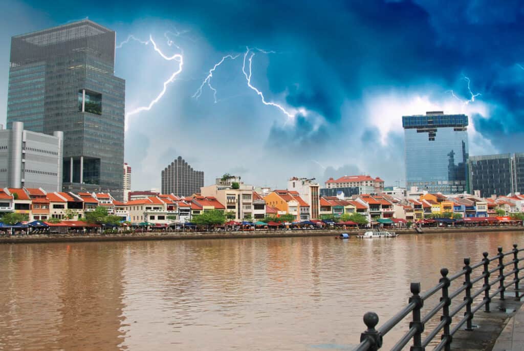 Thunderstorm with lightning over Boat Quay in Singapore. 