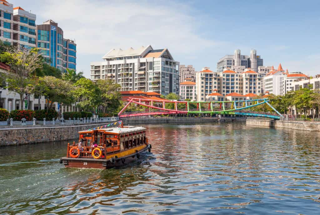 Bumboat and Alkaff Bridge at Robertson Quay Singapore.