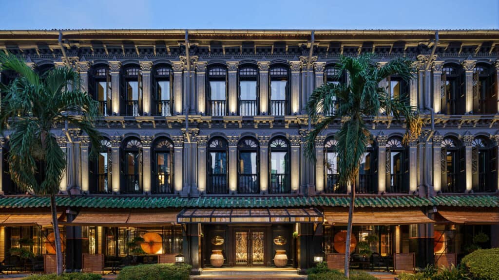 Duxton Reserve hotel Singapore exterior at dusk.