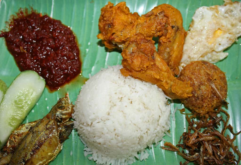 Nasi lemak on a banana leaf. 