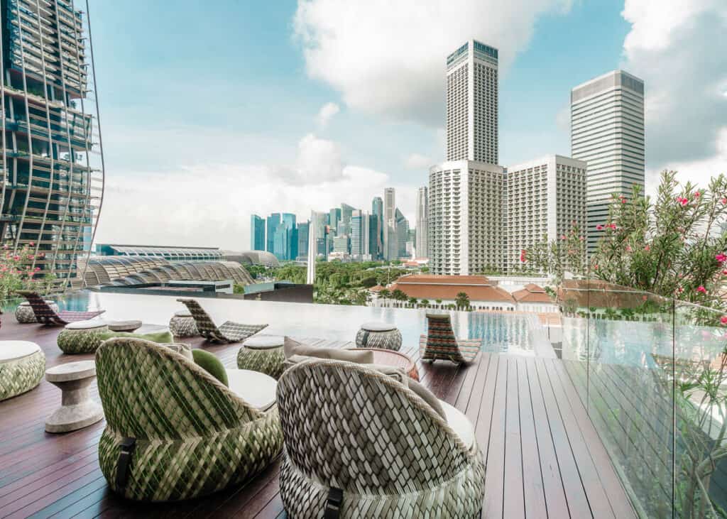 Cloud 9 pool and bar at Naumi Hotel Singapore with skyline view.