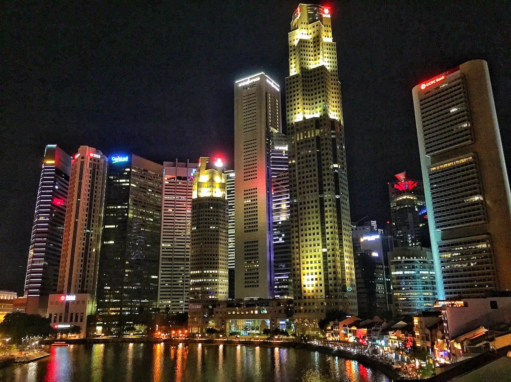 Boat Quay and Singapore Skyline at night.