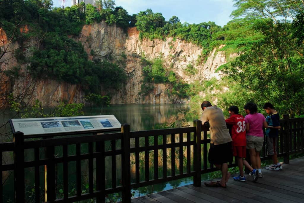 People looking at view at Quarry in Bukit Timah National Park.
