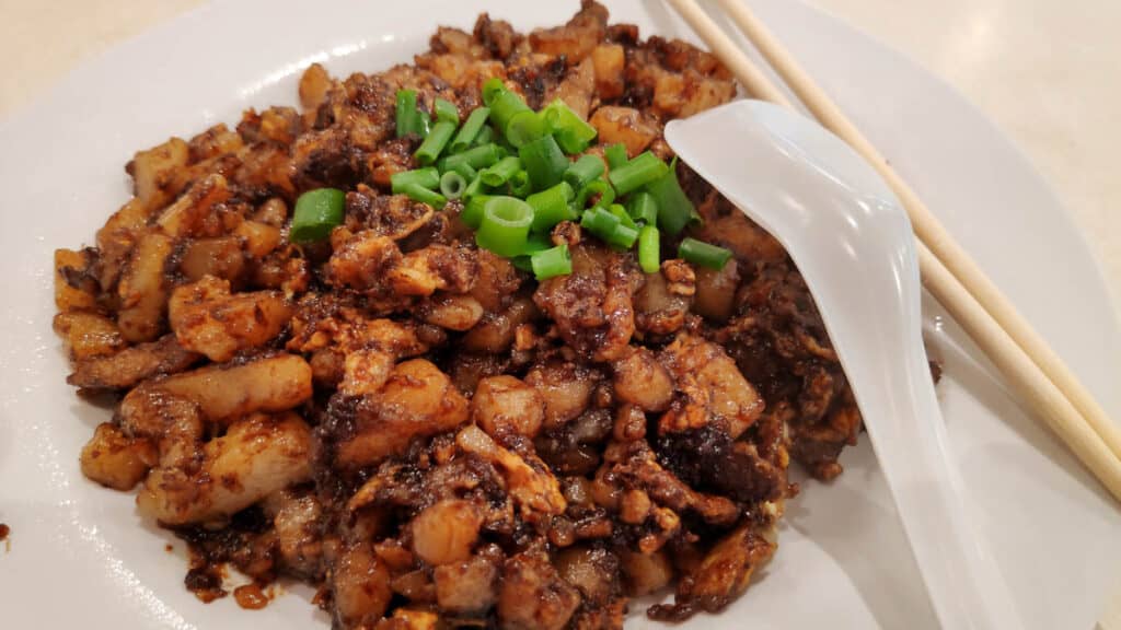 A plate of fried carrot cake. 