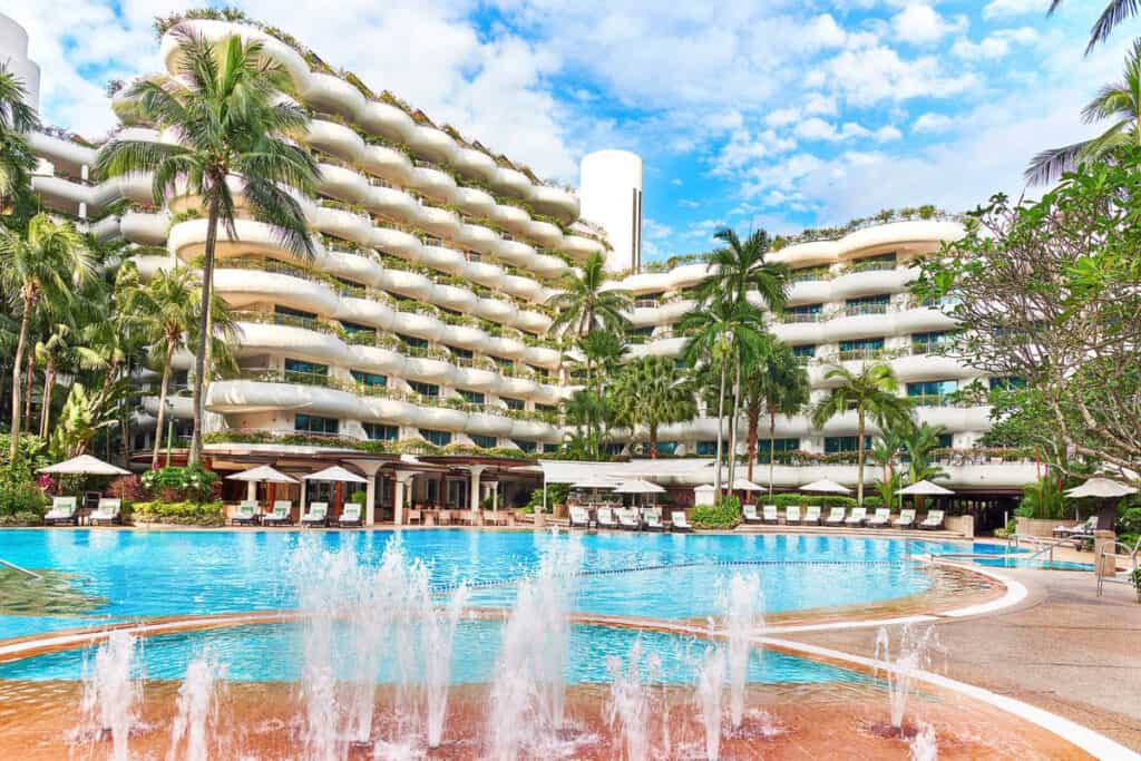 Shangri-La Singapore swimming pool with garden wing in background.