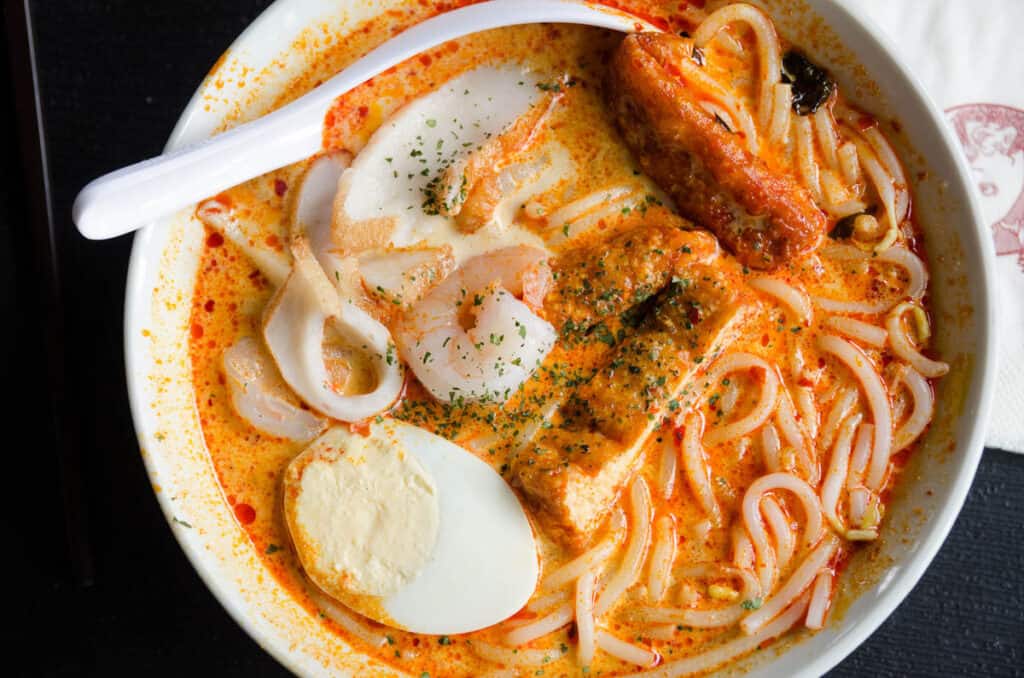 Above shot of a bowl of laksa. 