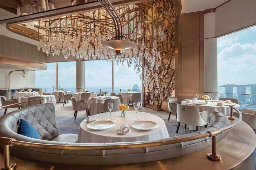 Jaan by Kirk Westaway restaurant interior showing light installation and view of Singapore.