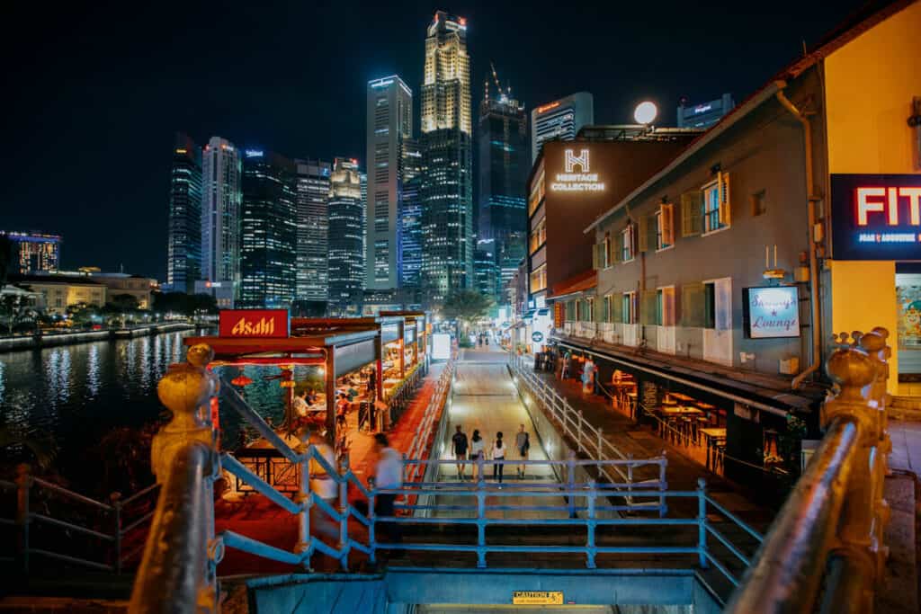 Boat Quay at nighttime with skyline view.