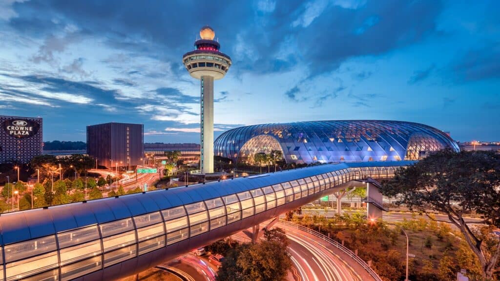 Changi airport exterior at nighttime.