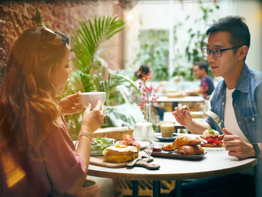 Couple having brunch together in Merci Marcel Singapore.