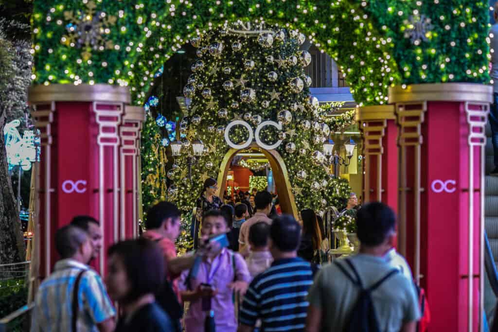 People on Orchard Road with Christmas lights. 