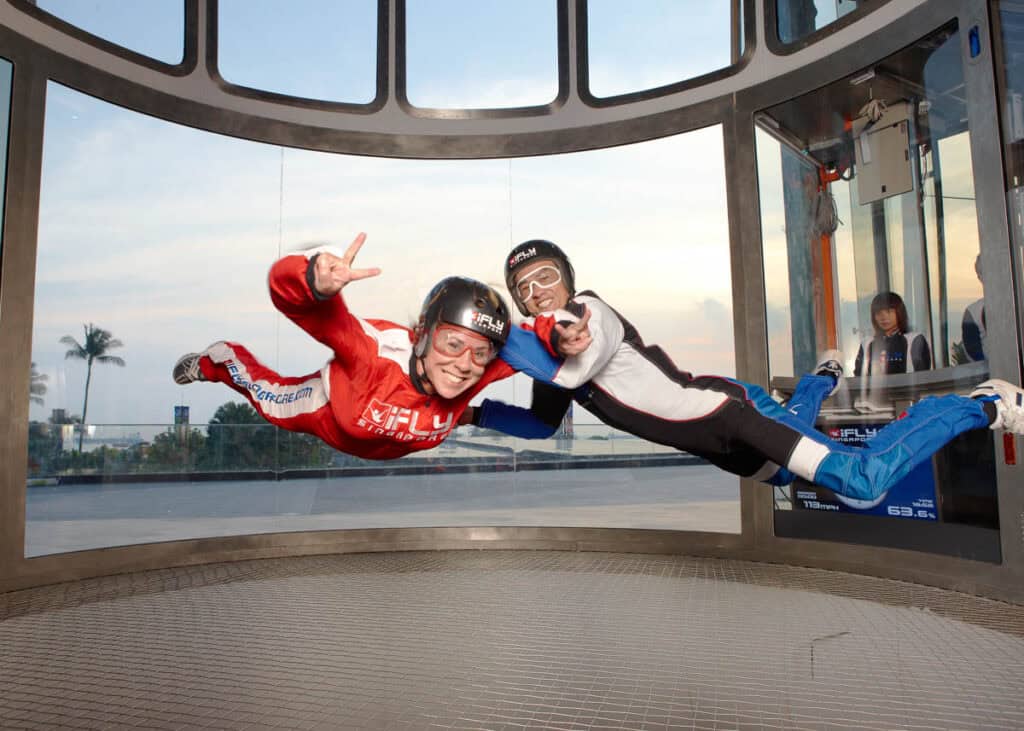Couple indoor skydiving.