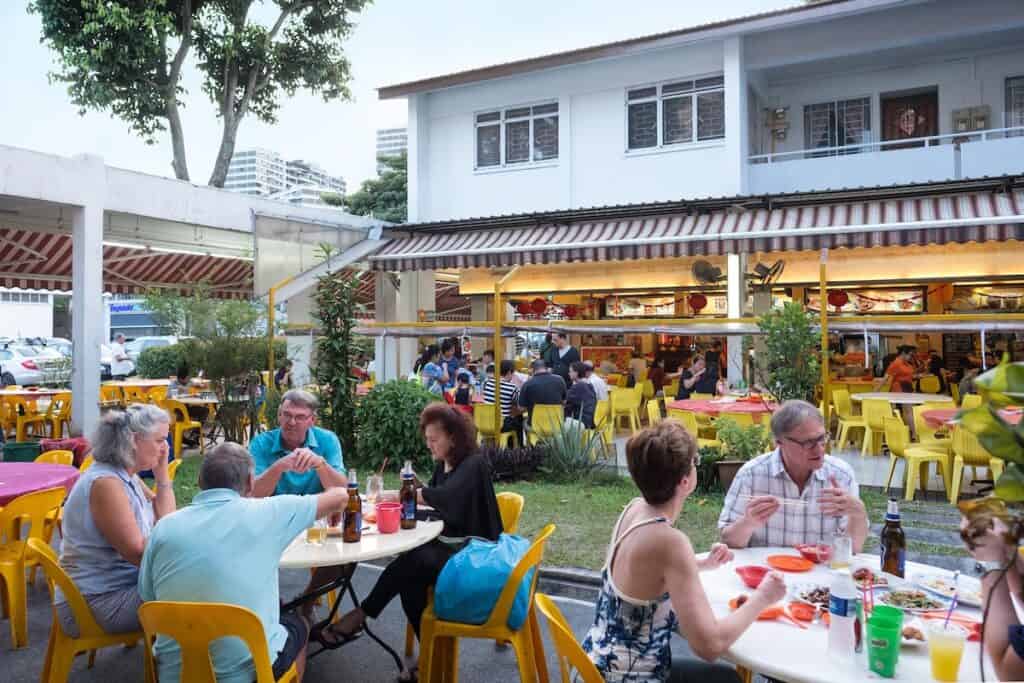 People eating zi char at Keng Eng Seafood, Singapore.