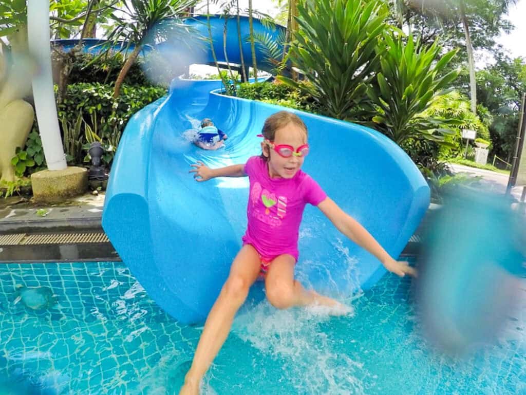 Kids on waterslide in hotel on Sentosa Island, Singapore.
