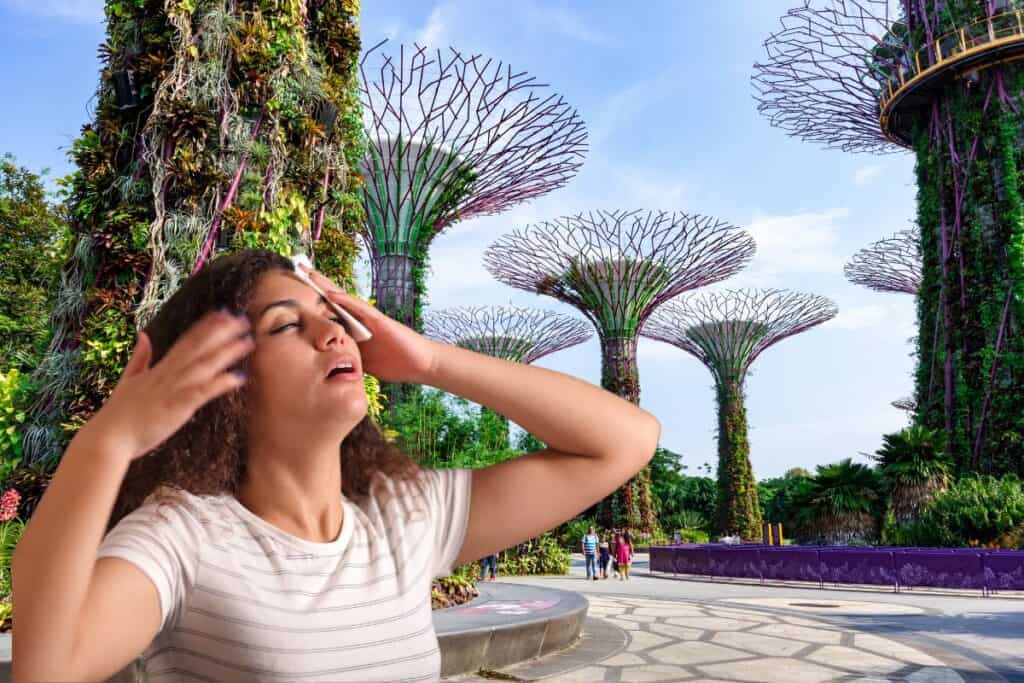 Woman feeling the heat at Gardens by the Bay Singapore.
