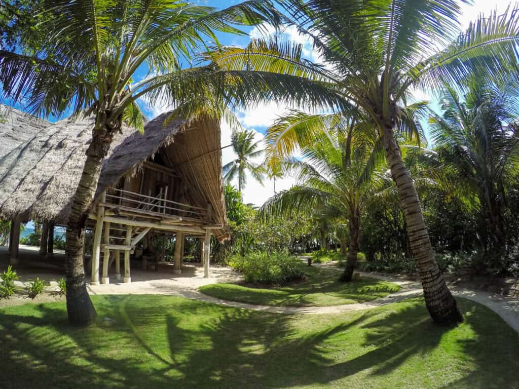 Villa among palm trees on Pulau Joyo.